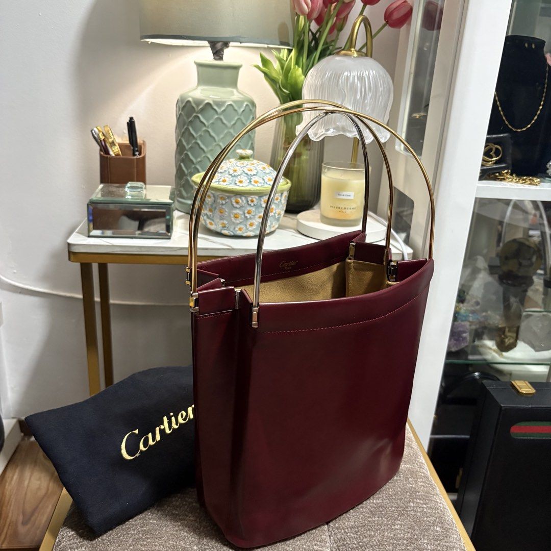 Authentic Cartier Trinity Burgundy Red Hand Bag (Category: Tote Bags) located in Binangonan. Submitted by makoleksyon (Listing ID 1462924319, Image 3). Description: Excellent condition Like new No flaws Crafted in High Quality Cartier Leather with Trinity Handles - given the meaning of Love, Fidelity and Friendship. Size: H-9.5 x W-8 x D-3.5 inches Bought in Japan 💯% Authentic Money back guarantee .