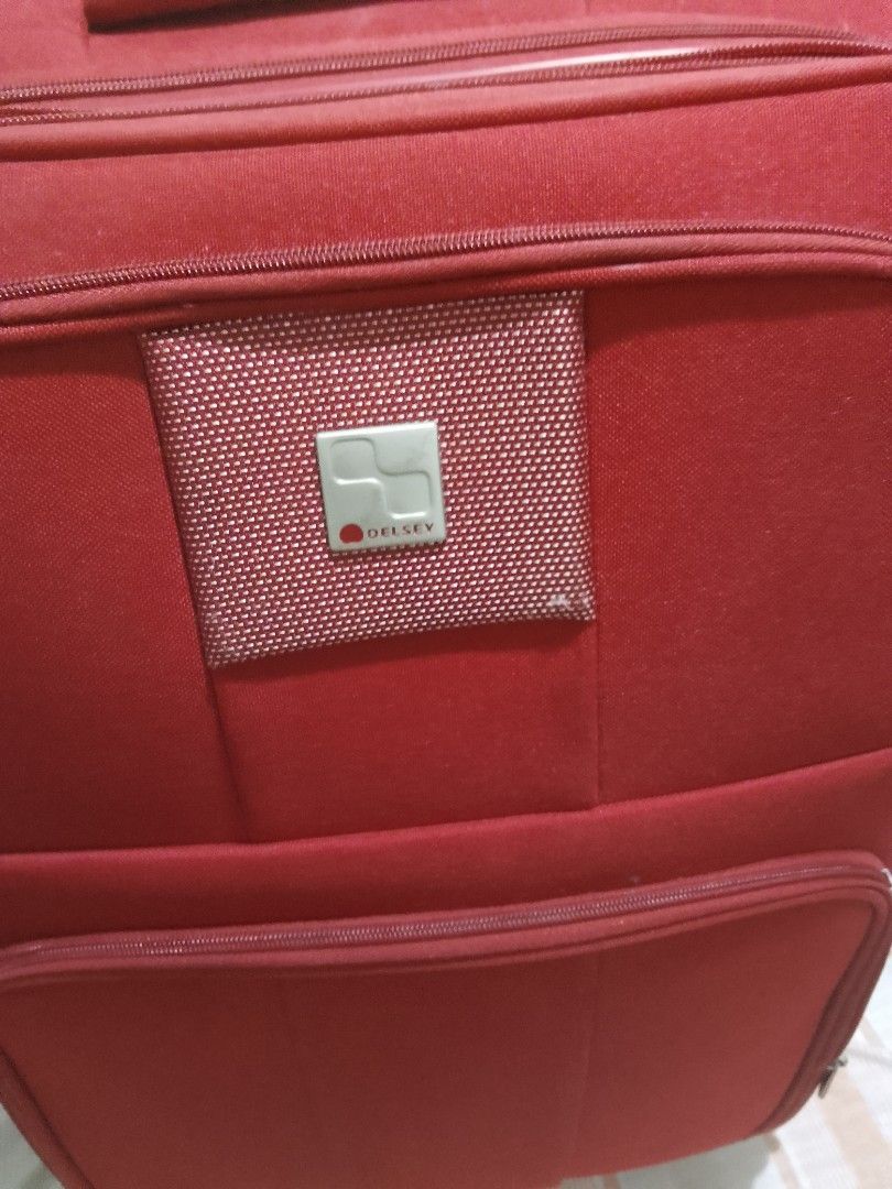 Authentic Delsey Red Luggage - RUSH (Category: Luggage) located in Pasig City. Submitted by exodusmomma (Listing ID 1463103276, Image 2). Description: - Red Delsey luggage - Front zippered pocket - Spacious main compartment - Shows some signs of wear, but still very functional - PRICE IS NEGOTIABLE .