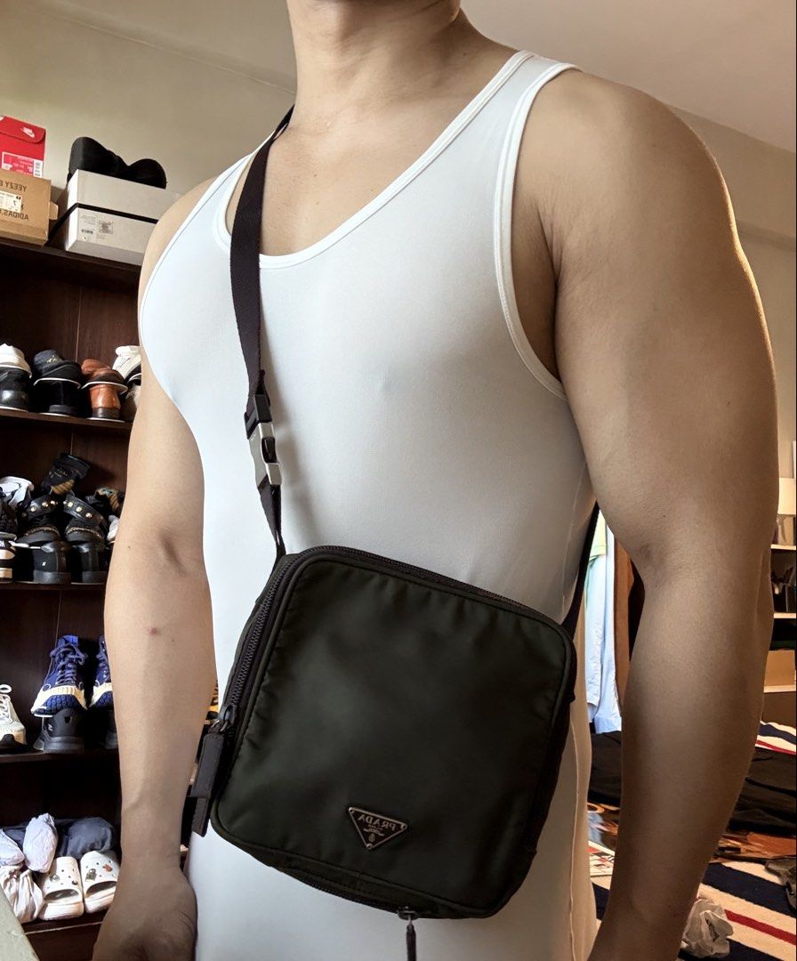 Authentic Prada Tessuto Nylon Multi-Utility Bag in Olive Green (Category: Luxury Bags & Wallets) located in Mandaluyong City. Submitted by wear_your_style (Listing ID 1462941669, Image 2). Description: Rare. Super nice. Bought preloved in Japan years ago. You may use this 3-way: puwede crossbody, handbag, or belt bag. Detachable sling. Ganda ng size, pa-square siya: 6X6 inches. But surprisingly marami ka malagay. It has 2 zipper compartments. Lam