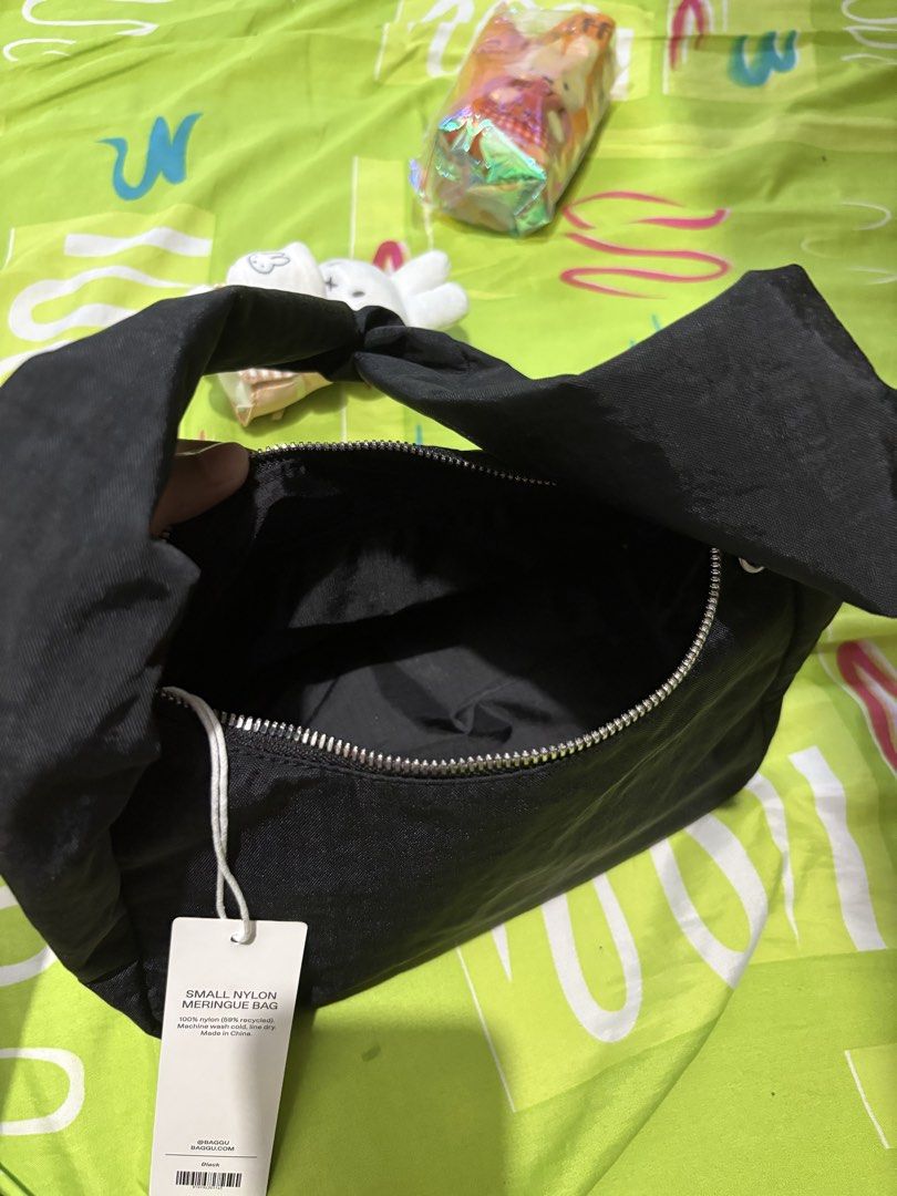 BAGGU Small Meringue Bag (Category: Purses & Pouches) located in Bacolor. Submitted by declutterwithmilo (Listing ID 1462943960, Image 3). Description: • Interior key leash • Metal zip closure and zipper pull • Recycled heavyweight nylon, recycled ripstop nylon lining • 11.5” drop strap • 9.6” W x 6” H x 5” D • Similar carrying capacity to Mini Nylon Shoulder Bag • Machine wash cold original price: 3,845 bought at certified calm 📦 RFS: declutter