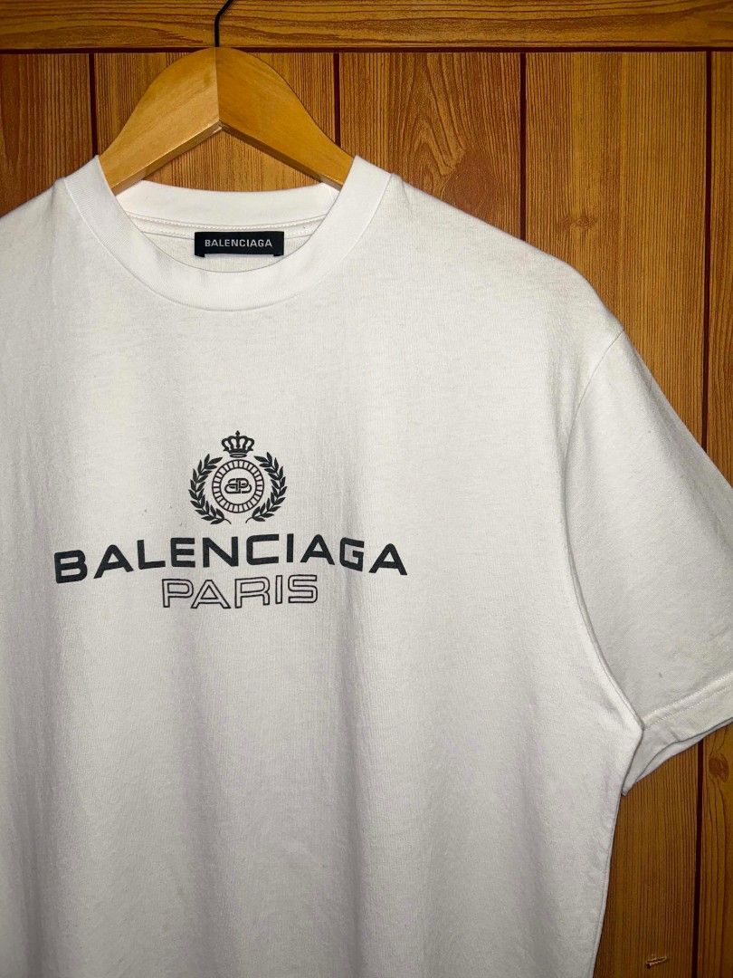 Balenciaga Paris Crest And Logo Laurel (Category: Tshirts & Polo Shirts ) located in Manila. Submitted by zerowastethriftco. (Listing ID 1463086204, Image 2). Description: -Excellent Condition -Dimes L27xW20 -No Issue.