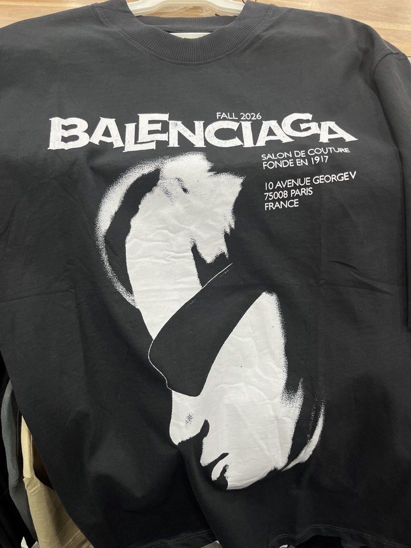 Balenciaga T-Shirt (Category: Men's Grooming) located in Manila. Submitted by cozyfinds.414 (Listing ID 1462969694, Image 1). Description: Details: • Condition: Brand New with Tags (BNWT) • Color: Black / Dark Grey Vintage Wash • Print: Balenciaga Salon De Couture Graphic Print • Size: Large (Unisex) • High quality heavy cotton fabric, maganda ang bagsak at makapal ang tela.