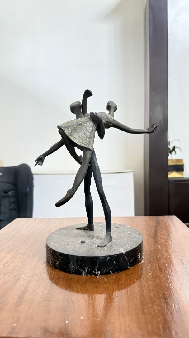 Ballet Dancers Sculpture on Marble Base (Category: Other Home Decor) located in Cainta. Submitted by villa_paraiso (Listing ID 1462954864, Image 1). Description: Stunning bronze-like sculpture featuring two ballet dancers in graceful motion. - Mounted on a sophisticated dark marble base. - A unique piece that adds artistry and elegance to any home decor. - Ideal for art collectors or as a special gift. Price is slightly negotiable..