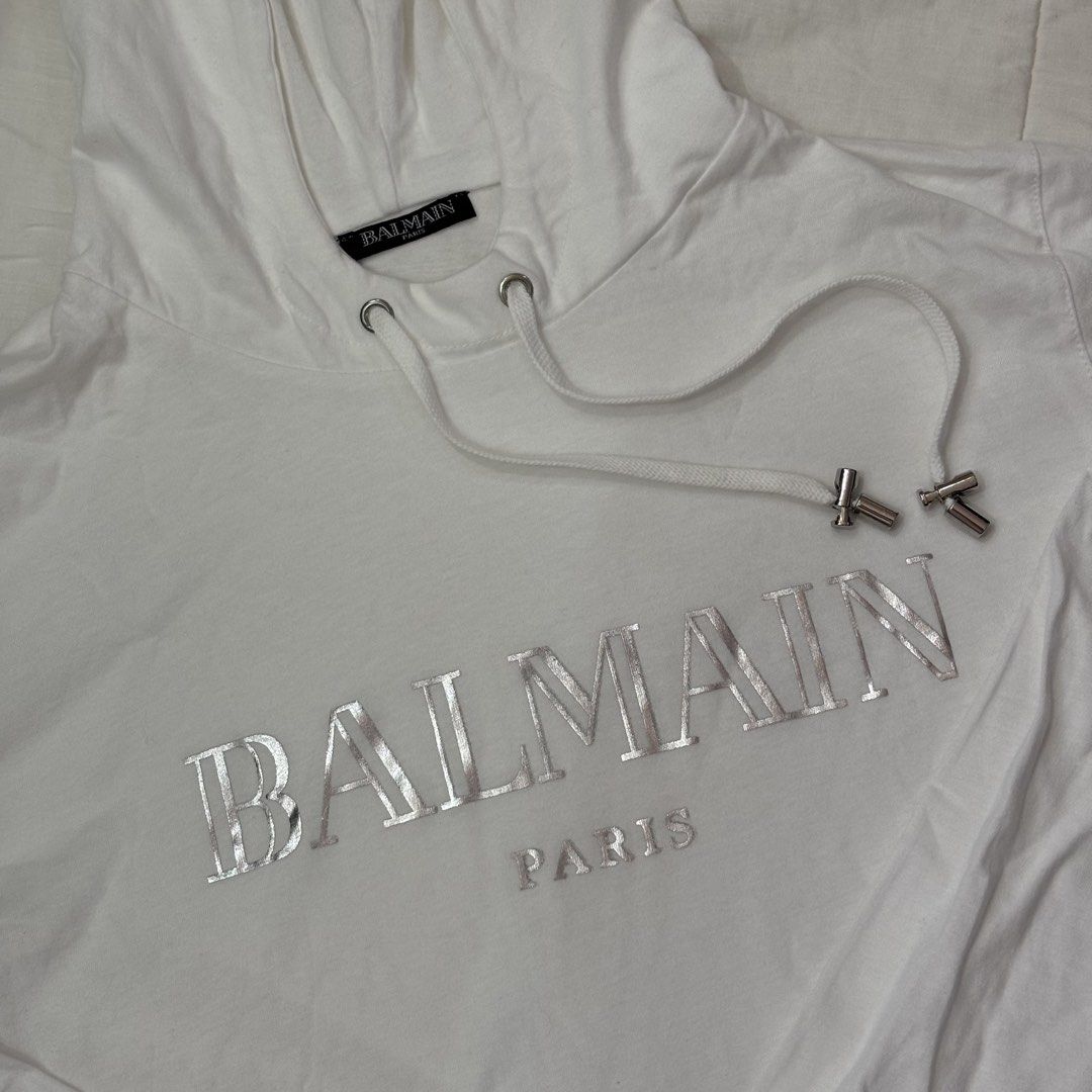 Balmain Paris White Hoodie (Category: Coats, Jackets and Outerwear) located in Iloilo. Submitted by manicfaerydream (Listing ID 1462930945, Image 1). Description: - Authentic White Balmain Paris Hoodie - Adjustable drawstring hood with sleek silver-tone hardware RFS: Not my style, was gifted to me..