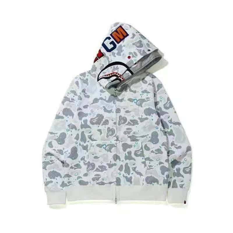 BAPE Shark Hoodie - Multiple Colorways Available (Category: Hoodies) located in Manila. Submitted by kobarceo (Listing ID 1462908946, Image 1). Description: - Iconic BAPE Shark Hoodie - Signature shark mouth design on the hood - Available in various camouflage patterns and colorways - Zip-up front with pockets - A must-have statement piece for any streetwear enthusiast - Please check photos for specific designs and color options.