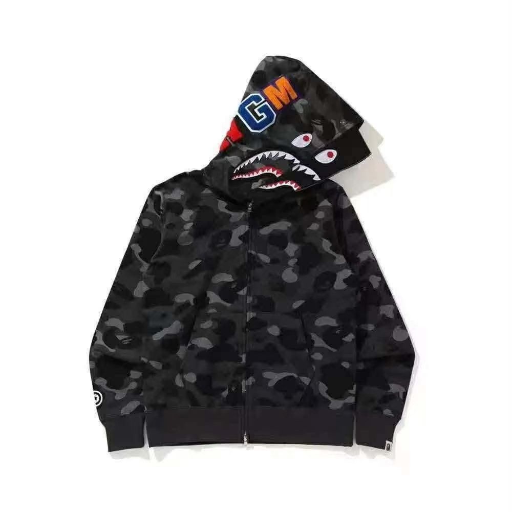 BAPE Shark Hoodie - Multiple Colorways Available (Category: Hoodies) located in Manila. Submitted by kobarceo (Listing ID 1462908946, Image 2). Description: - Iconic BAPE Shark Hoodie - Signature shark mouth design on the hood - Available in various camouflage patterns and colorways - Zip-up front with pockets - A must-have statement piece for any streetwear enthusiast - Please check photos for specific designs and color options.