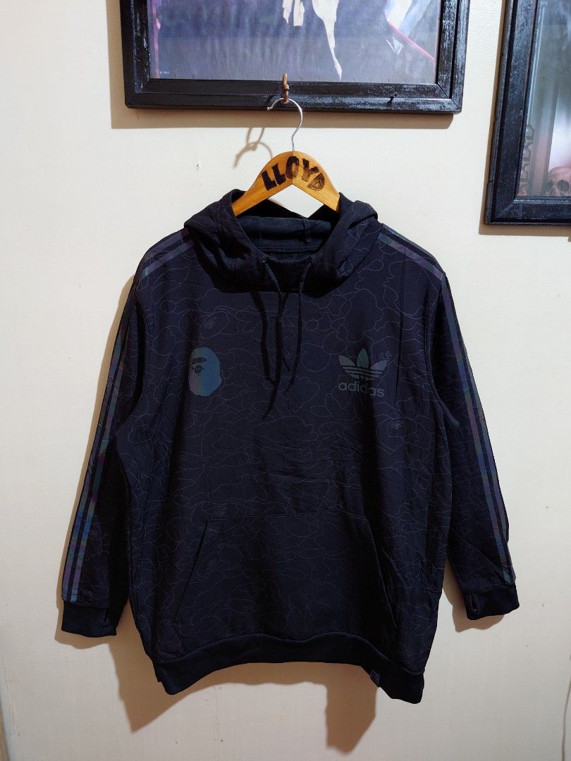 Bape X Adidas (Category: Hoodies) located in Taytay. Submitted by GRIND720_II (Listing ID 1463023877, Image 1). Description: Bape X Adidas refletorize hoodie small over size Best fit to LARGE 23.5 X 29 Excellent condition 4999 issue fade yung tag sa hem check last picture.