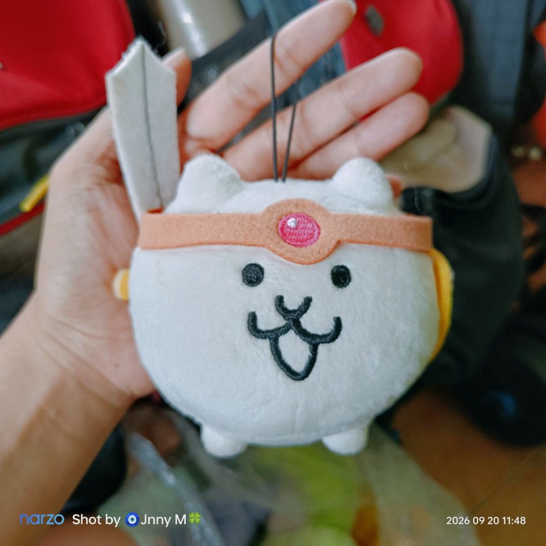 Battle Cats Cat Plush Keychain with Sword (Category: Plushies & Soft Toys) located in Taguig. Submitted by mhayestufftoys (Listing ID 1462916079, Image 1). Description: - Adorable Battle Cats plush keychain - Features the iconic cat character with a mini sword - Comes with a loop for easy hanging on bags or keys - Small, portable, and a must-have for Battle Cats fans.