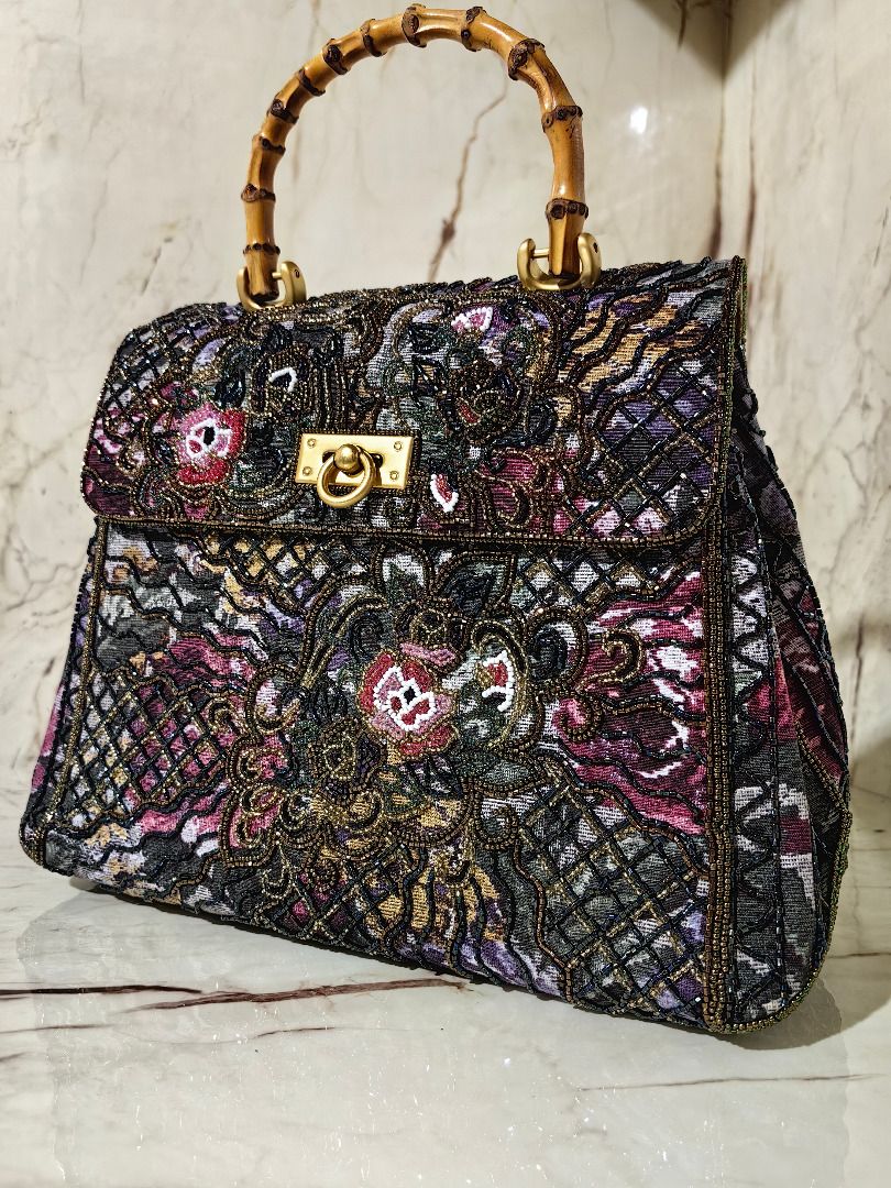 Beaded Tapestry Handbag with Bamboo Handle (Category: Tote Bags) located in Tarlac. Submitted by jeremiah.curator.2026 (Listing ID 1462891158, Image 2). Description: - Unique beaded tapestry handbag - Colorful floral and abstract pattern - Natural bamboo top handle - Secure gold-tone clasp closure - Perfect statement accessory - Dimensions: Approx. 11" wide x 8" tall.