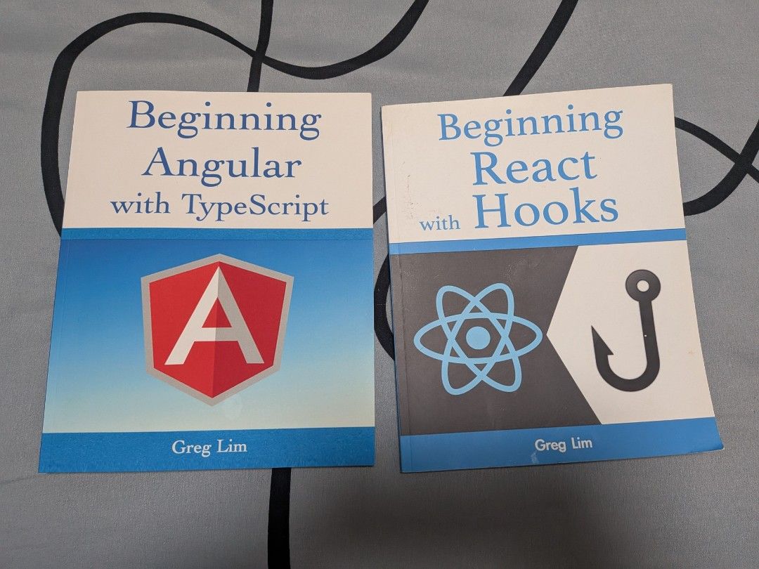 Beginning Angular with TypeScript & Beginning React Hooks Books (Category: Storybooks) located in Singapore. Submitted by hoxuanvinh (Listing ID 1462905116, Image 1). Description: - Two programming books by Greg Lim - Book 1: Beginning Angular with TypeScript - Book 2: Beginning React Hooks - Great for learning web development.