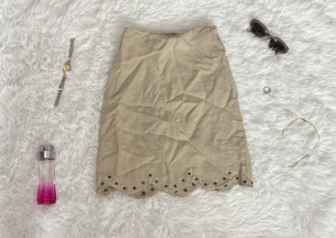 Beige Eyelet Hem Midi Skirt (Category: Skirts) located in Tuguegarao City. Submitted by love_clothies (Listing ID 1462902730, Image 1). Description: - Cute beige midi skirt - Features a scalloped hem with eyelet details - Made from a linen-like material - Versatile for casual or dressed-up looks - Easy to pair with various tops and accessories.