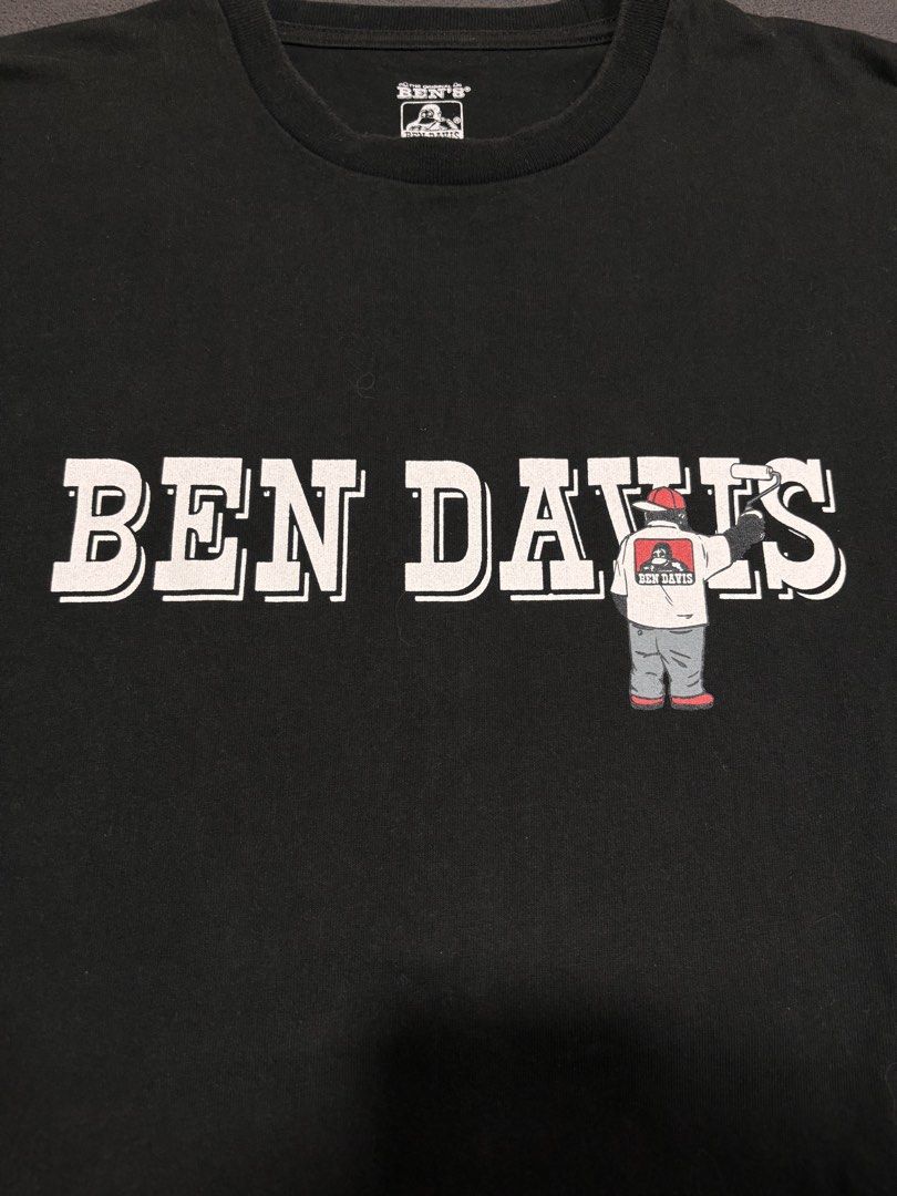 Ben Davis T-shirt Large Black Graphic Tee (Category: Tshirts & Polo Shirts ) located in Mabalacat. Submitted by _limitlessfashion (Listing ID 1462899865, Image 2). Description: - Authentic Ben Davis graphic t-shirt - No major issue - Color rate & condition 9.2/10 - Length 29 - Width 21 - Features iconic Ben Davis character logo - Size: Large - Material: Made in China - Ideal for casual everyday wear.
