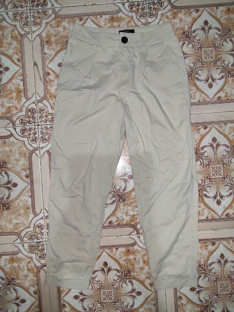 Bershka Beige Cropped Pants (Category: Other Bottoms) located in Manila. Submitted by chocobutternut_ (Listing ID 1463071488, Image 1). Description: - Beige cropped pants from Bershka - Button and zip closure - Two front pockets and two back pockets - Made in Turkey - Size: EUR 36 / USA 04 / MEX 26 - Ideal for casual wear - with belt note: with stains (not sure if washable).