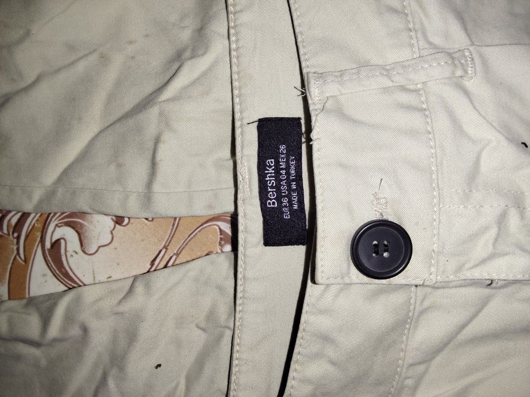 Bershka Beige Cropped Pants (Category: Other Bottoms) located in Manila. Submitted by chocobutternut_ (Listing ID 1463071488, Image 2). Description: - Beige cropped pants from Bershka - Button and zip closure - Two front pockets and two back pockets - Made in Turkey - Size: EUR 36 / USA 04 / MEX 26 - Ideal for casual wear - with belt note: with stains (not sure if washable).