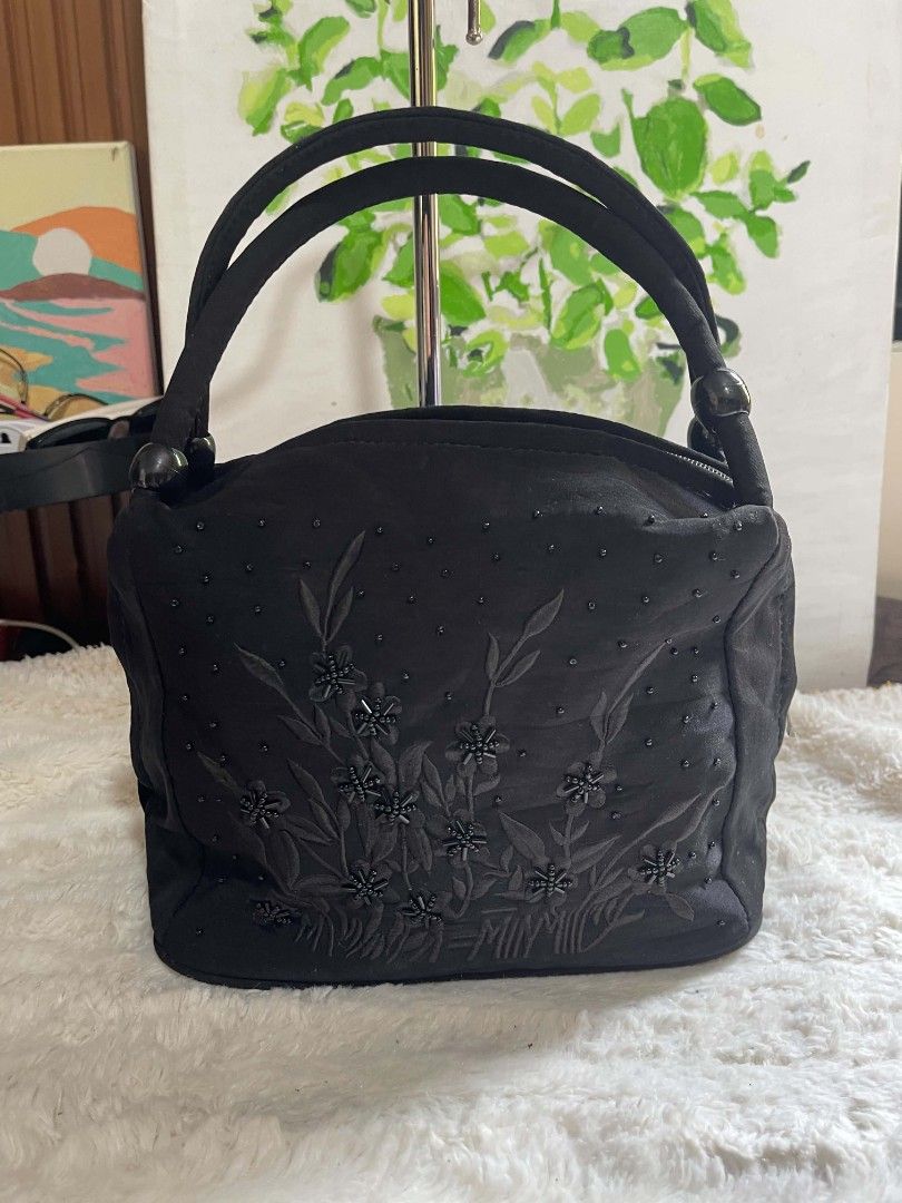 Black Beaded Floral Handbag with Zipper Closure (Category: Tote Bags) located in Naawan. Submitted by twilly.apparel2 (Listing ID 1462906018, Image 1). Description: - missing 1 puller Cute black handbag - Beaded floral embroidery on front - Top zipper closure - Zippered pocket on back - Lined interior with small pocket - Decorative beaded handles - Ideal for night outs or special occasions.