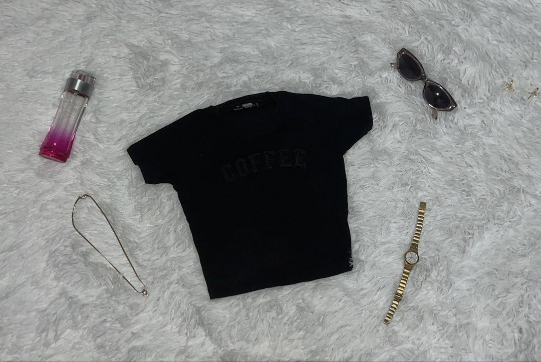 Black 'Coffee' Graphic T-shirt (Category: Tshirts & Polo Shirts ) located in Tuguegarao City. Submitted by love_clothies (Listing ID 1462903927, Image 1). Description: - Black cropped t-shirt - Features a 'Coffee' graphic print - Estimated size: Small - Ideal for casual wear - Versatile: pairs well with jeans or shorts - Easy to style for a chic look.