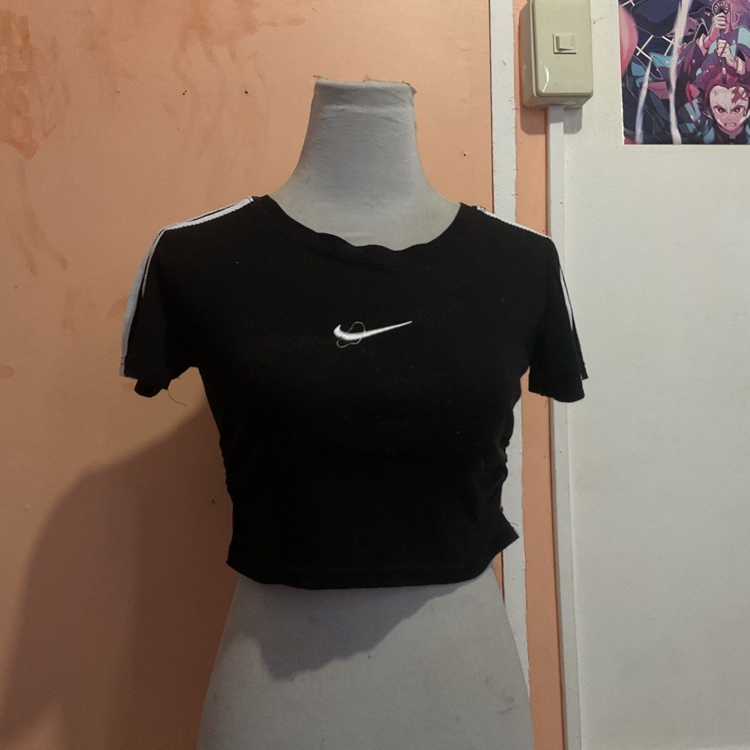 Black Crop Top with White Stripes (Category: Others Tops) located in Naga. Submitted by asrid.32 (Listing ID 1462950649, Image 1). Description: - Black Nike crop top - White stripes on sleeves - Small white Nike logo on chest - Cropped length - Very stretchy material - Ideal for casual wear or workouts - Pairs well with jeans or shorts.
