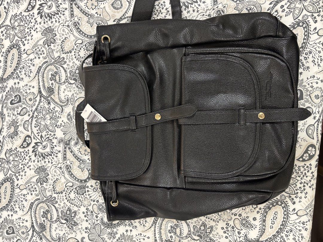 Black Faux Leather Backpack with Multiple Pockets (Category: Backpacks) located in Villasis. Submitted by smnthg12 (Listing ID 1463034933, Image 1). Description: Black Faux Leather Backpack -Spacious -Brand New.