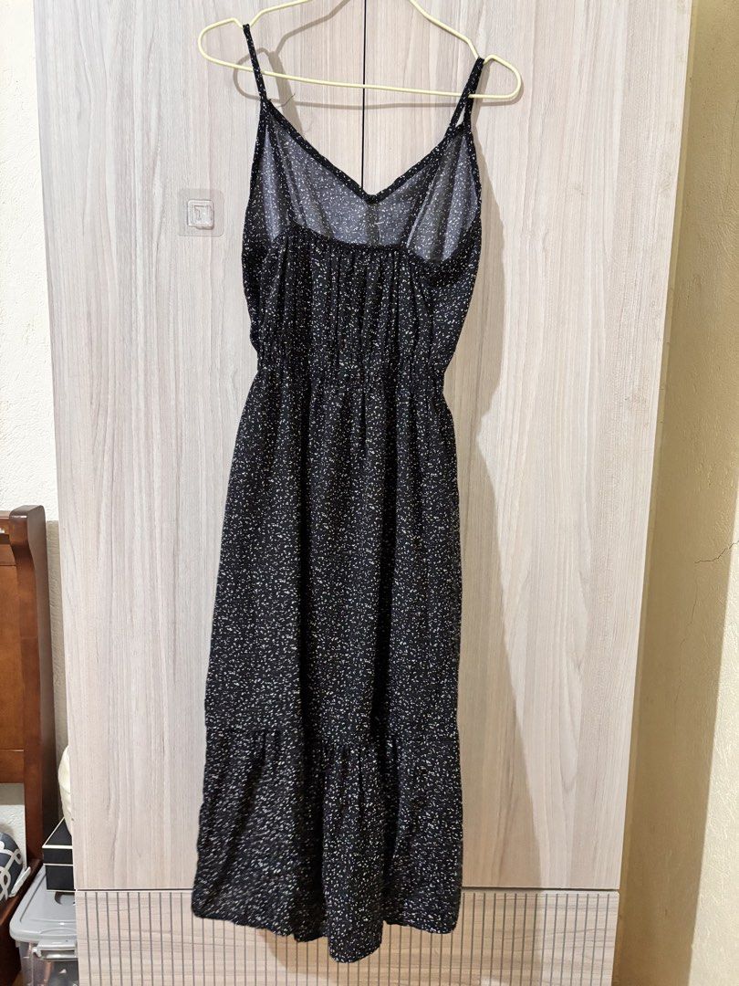 Black Floral Spaghetti Strap Midi Dress (Category: Dresses) located in Leyte. Submitted by modernpersephone (Listing ID 1463035056, Image 2). Description: - Black midi dress - Dainty floral print - Spaghetti straps - Elasticated waist - Tiered hemline for flow - Versatile: great for casual outings or dressing up Bought in Thailand Never worn Condition: 9/10.