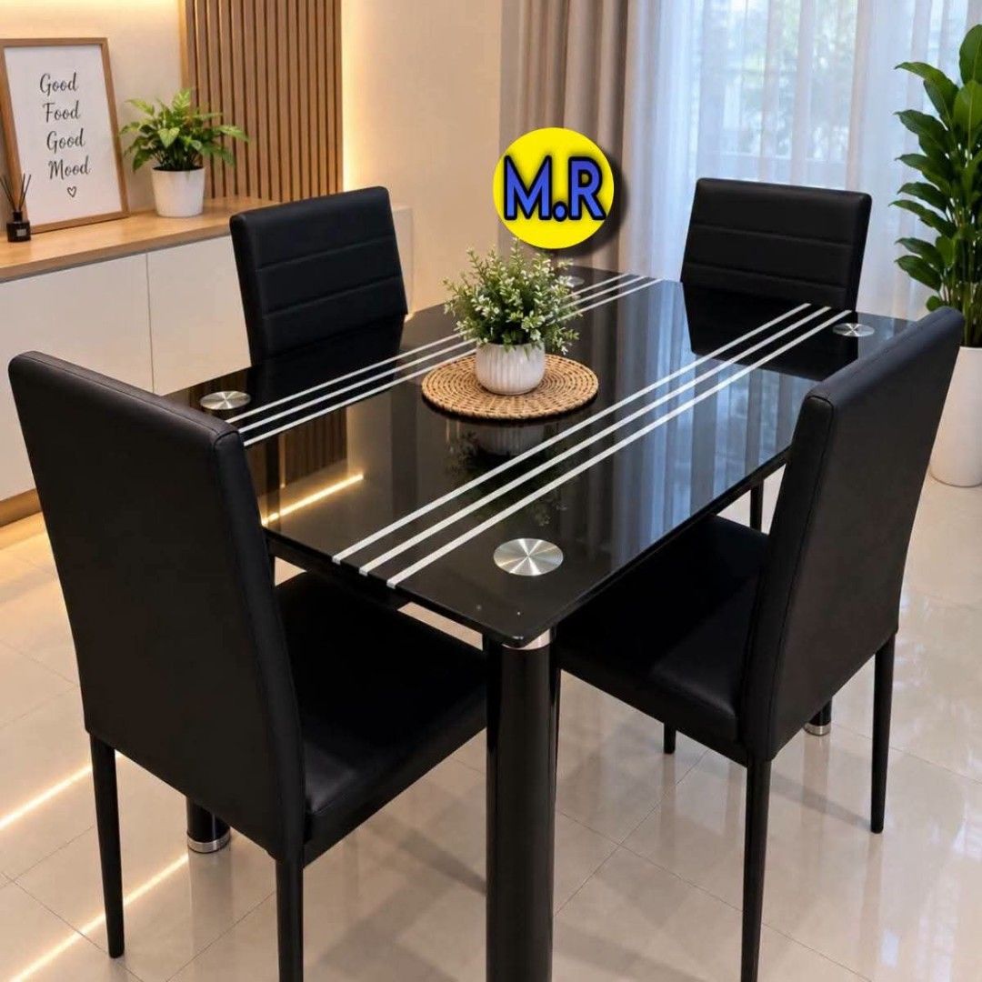 Black Glass Dining Table with 4 Chairs (Category: Tables & Sets) located in Quezon City. Submitted by marecel146 (Listing ID 1463106440, Image 3). Description: - Modern dining set - Black glass tabletop with silver stripe details - Includes 4 black faux leather chairs - Seats up to 4 people comfortably - Ideal for small dining areas - Easy to clean surface - Sturdy metal legs.