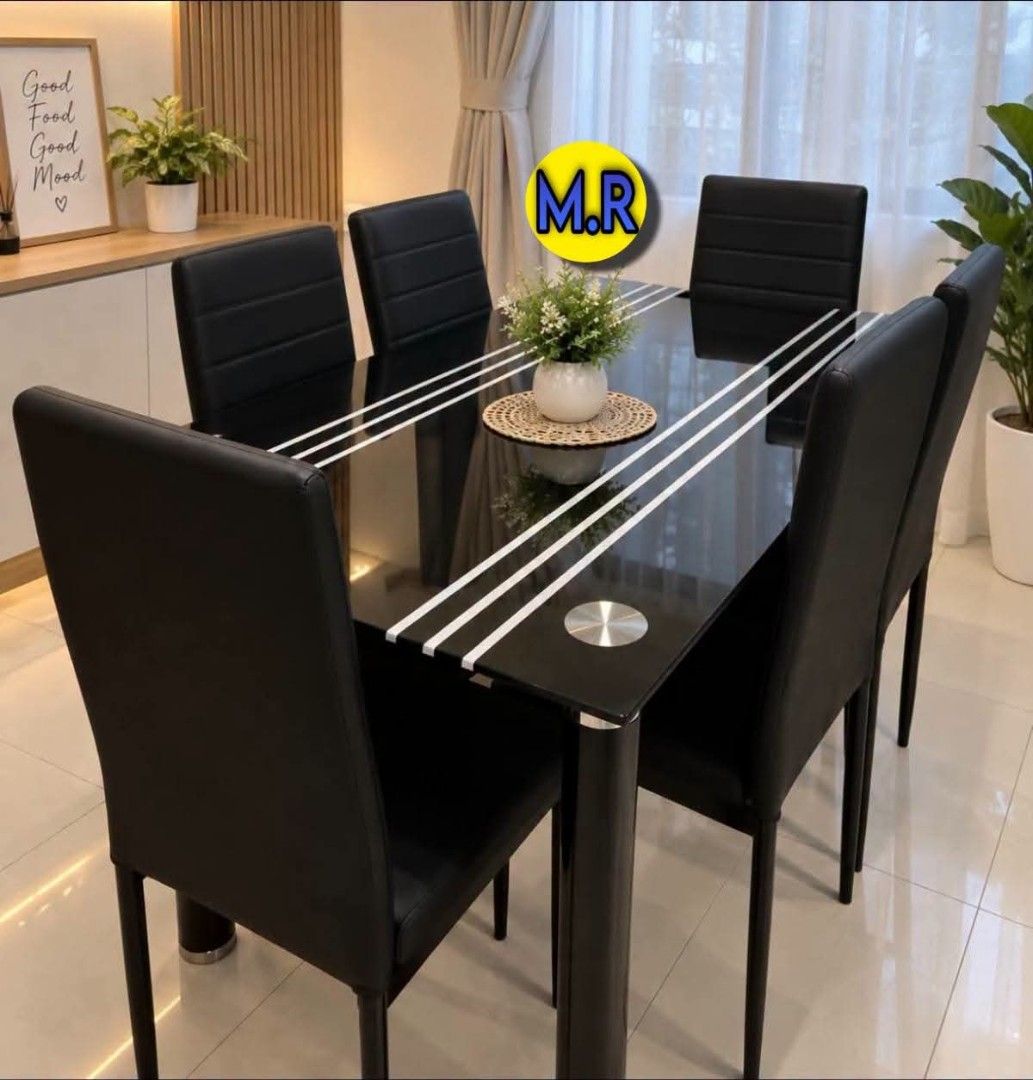 Black Glass Dining Table with 4 Chairs (Category: Tables & Sets) located in Quezon City. Submitted by marecel146 (Listing ID 1463106440, Image 2). Description: - Modern dining set - Black glass tabletop with silver stripe details - Includes 4 black faux leather chairs - Seats up to 4 people comfortably - Ideal for small dining areas - Easy to clean surface - Sturdy metal legs.