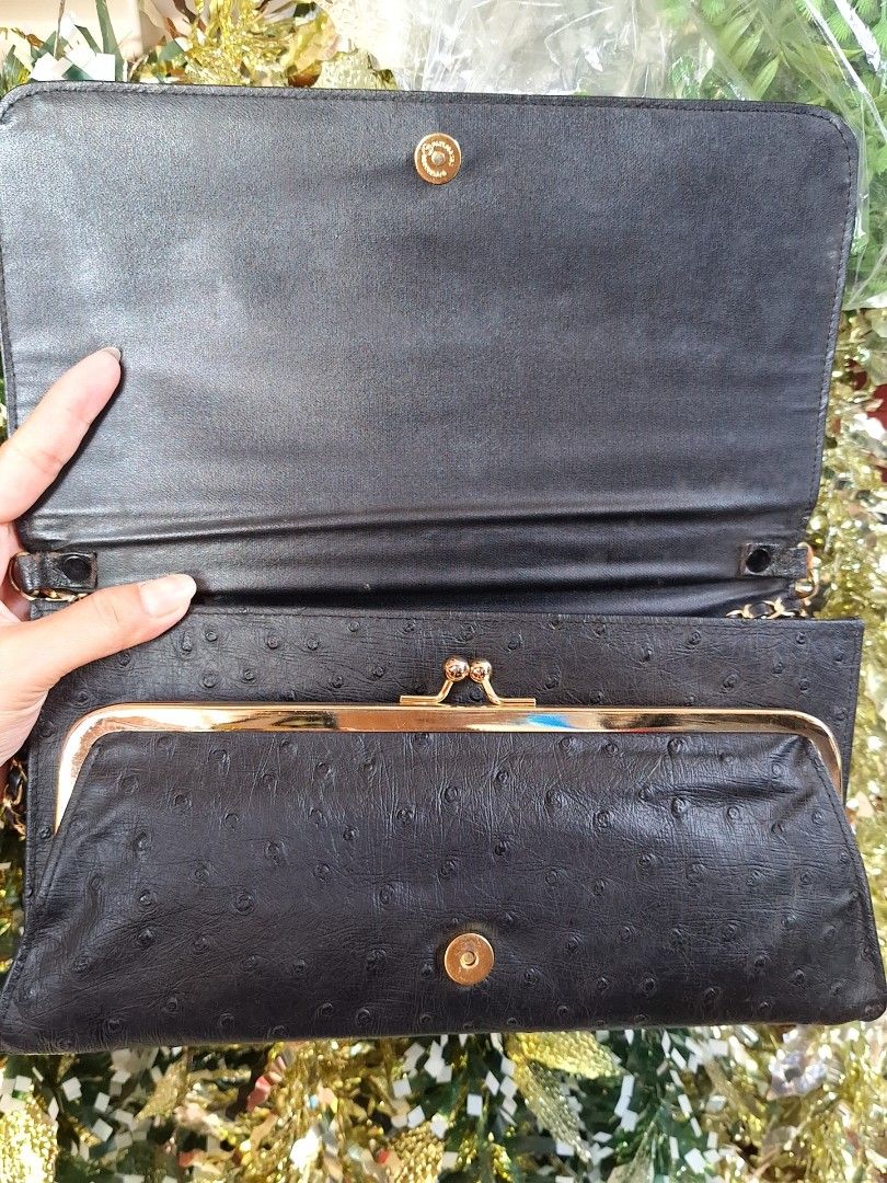 Vintage Ostrich Embossed Clutch Bag (Category: Clutches) located in Pasig City. Submitted by shopwithxandra (Listing ID 1462895083, Image 3). Description: - Elegant black clutch bag - Luxurious ostrich embossed texture - Stylish gold chain strap - Secure magnetic snap closure on front flap - Convenient interior zippered pocket - Spacious main compartment - Ideal for evening events and special occasions.