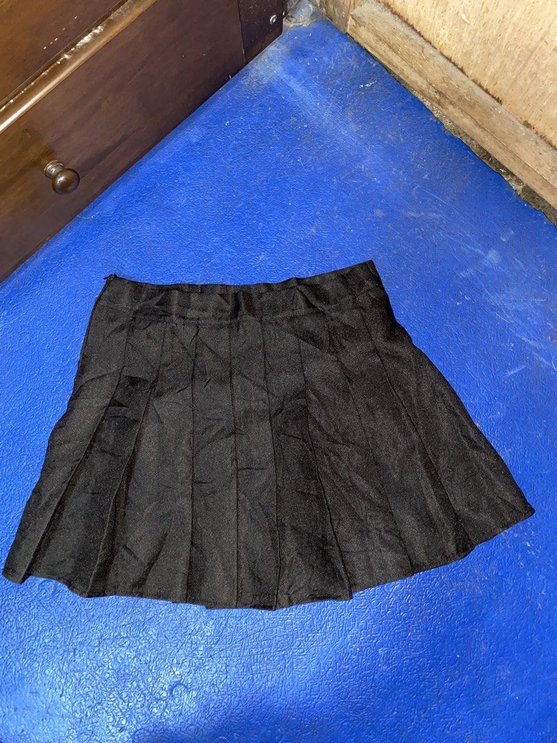 Black Pleated Mini Skirt (Category: Skirts) located in Manila. Submitted by cutedacayo_09 (Listing ID 1463037878, Image 1). Description: - Black pleated mini skirt - Zipper closure at the back - Fabric has a subtle sheen - Versatile for casual or dressed-up looks - Easy to style with various tops.