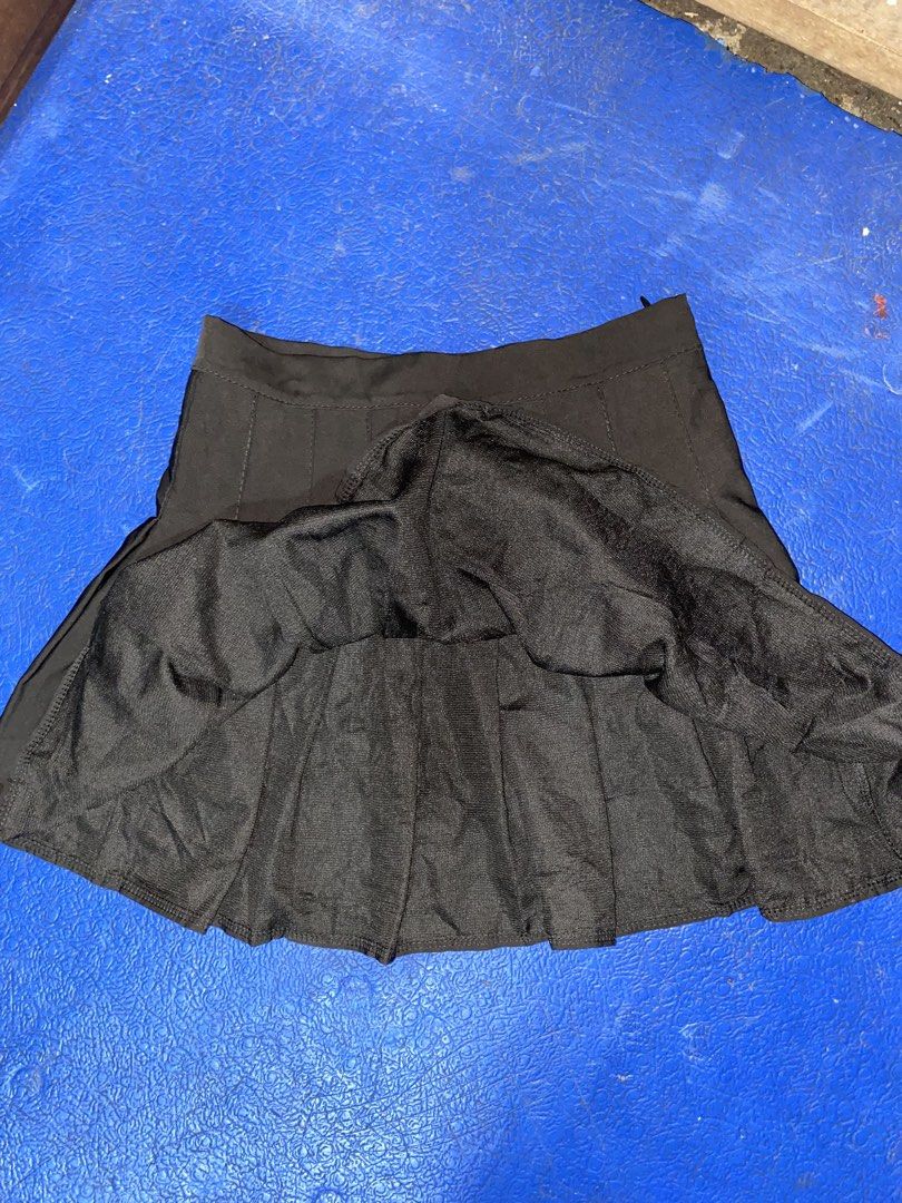 Black Pleated Mini Skirt (Category: Skirts) located in Manila. Submitted by cutedacayo_09 (Listing ID 1463038087, Image 2). Description: - Black pleated mini skirt - High-waisted design - Fits approximately size Small to Medium - Versatile for casual or dressed-up looks - Effortlessly pairs with various tops - Convenient back zipper closure.