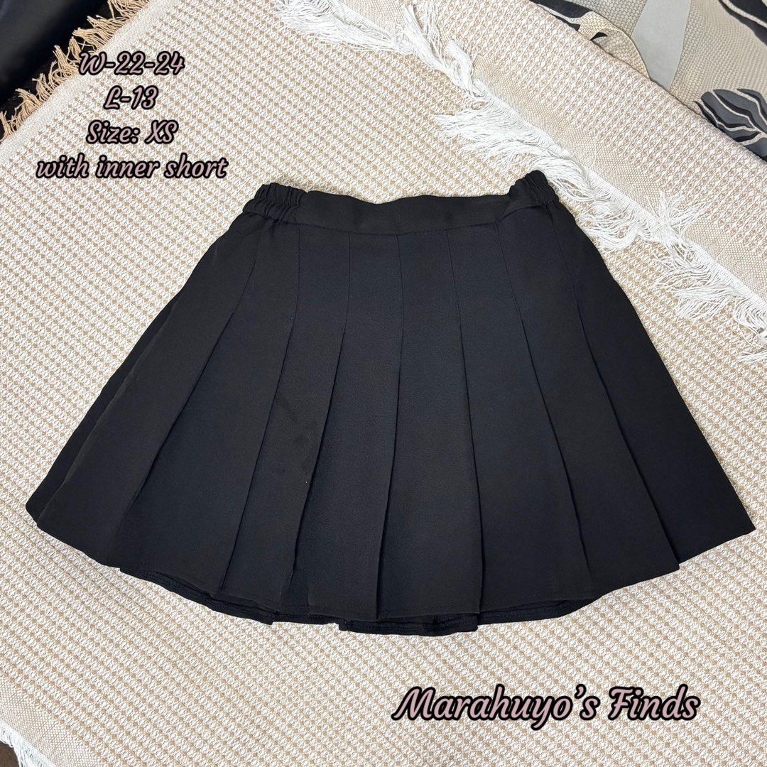 Black Pleated Mini Skirt with Inner Short (Category: Skirts) located in Mabalacat. Submitted by marahuyos.finds (Listing ID 1462930387, Image 1). Description: - Black pleated mini skirt - Includes inner shorts for added coverage - Comfortable elastic waistband - Versatile for preppy or casual styles - Easy to pair with various tops and sweaters.