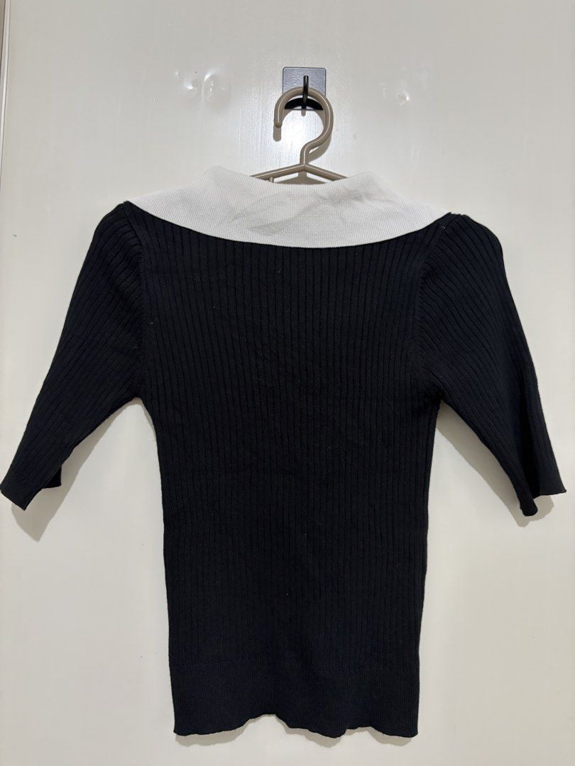 Black Ribbed Knit Top with White Collar (Category: Blouses) located in Pasig City. Submitted by carissuh99 (Listing ID 1462997230, Image 2). Description: - Black ribbed knit fabric - Contrasting white collar - Three-quarter sleeves - Stretchy material for comfort - Versatile: pairs well with jeans or skirts - Simple and classic design.