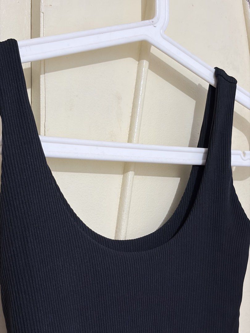 Black Ribbed Scoop Neck Crop Tank Top (Category: Sleeveless) located in Manila. Submitted by vexie.nyahmmy (Listing ID 1462920748, Image 2). Description: - Basic black ribbed crop tank - Comfortable scoop neck design - Stretchy material for a great fit - Perfect for layering or wearing solo - Effortlessly pairs with any bottoms - Ideal for casual wear.
