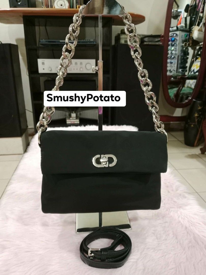 black shoulder bag featuring a chunky silver-tone chain strap and a distinctive interlocking clasp (Category: Cross-body Bags) located in Cainta. Submitted by smushypotatoo (Listing ID 1463095809, Image 1). Description: .