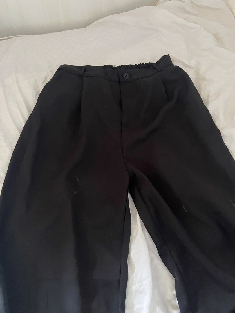 Black Wide Leg Pants Slacks (Category: Other Bottoms) located in Manila. Submitted by happydani (Listing ID 1462951435, Image 1). Description: - 3XL - Stylish black wide leg pants - Comfortable elastic waistband at the back - Secure button and zip closure at the front - Elegant pleated detail - Made from 100% polyester - Origin: China - Please note: there are some light marks on the front, kindly check the photos provided..