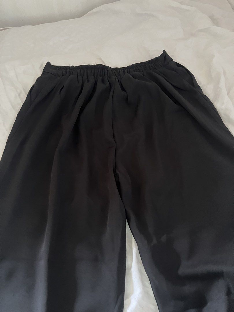 Black Wide Leg Slacks Pants Size Plussize (Category: Other Bottoms) located in Manila. Submitted by happydani (Listing ID 1462951276, Image 3). Description: - 4XL - Stylish black culottes - Wide leg design - Comfortable elastic waistband at the back - Features convenient pockets - Versatile for casual or dressed-up looks - Easy to pair with any top - Washing instructions available on tag.