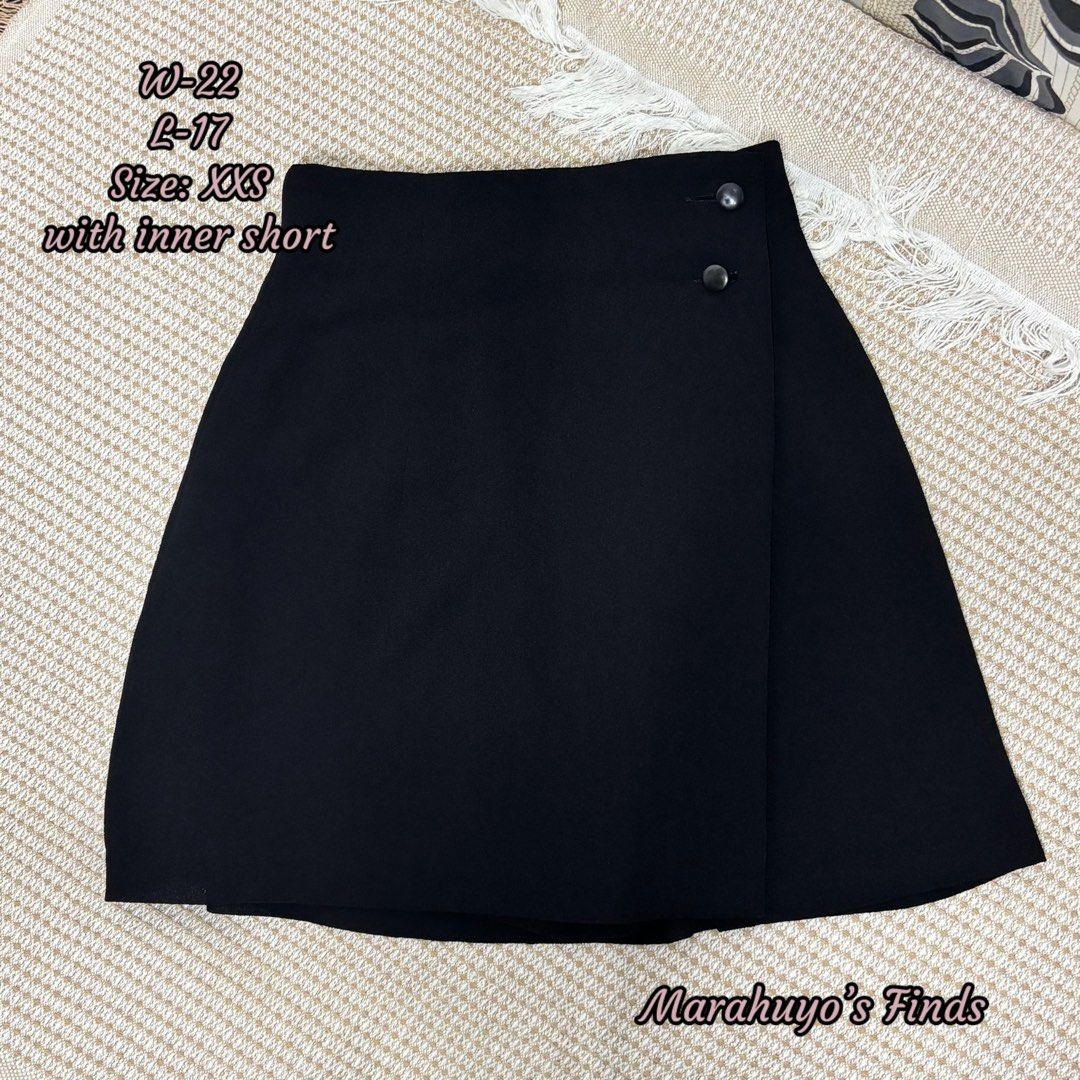 Black Wrap Skirt with Inner Short (Category: Skirts) located in Mabalacat. Submitted by marahuyos.finds (Listing ID 1462930335, Image 1). Description: - Chic black wrap skirt - Features inner shorts for added coverage - Size: XXS - Measurements: Waist 22", Length 17" - Perfect for both casual outings and dressy events.