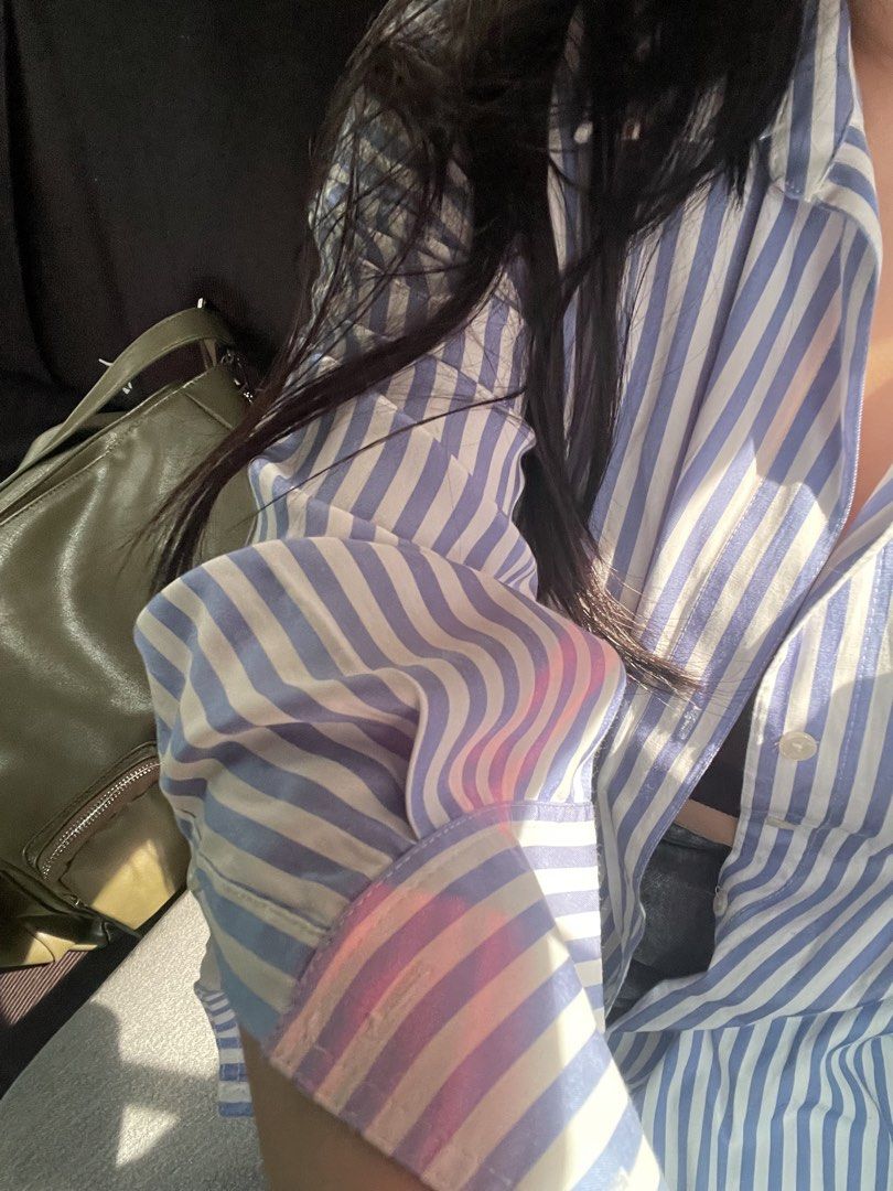 Blue and White Striped Button-Up Shirt (Category: Shirts) located in Manila. Submitted by mallowieee (Listing ID 1463003002, Image 2). Description: - Classic blue and white striped pattern - Long sleeves with button cuffs - Relaxed fit for comfort - Versatile for casual or work attire - Pairs well with jeans or trousers.