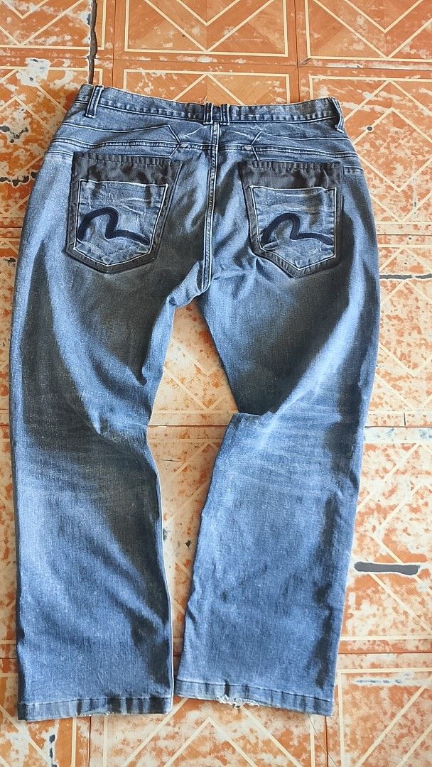 Blue Distressed Denim Jeans (Category: Jeans) located in Davao. Submitted by mrsuavenz (Listing ID 1463070063, Image 2). Description: - Classic blue denim jeans - Distressed look with rips and fading - Straight leg fit - Button and zip closure - Two back pockets with embroidered detail - Ideal for casual wear.