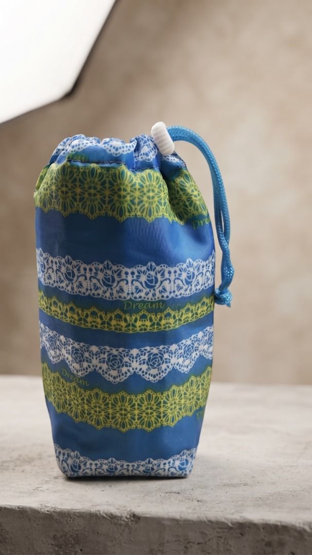 Blue Drawstring Pouch with Lace and Floral Pattern (Category: Purses & Pouches) located in Quezon City. Submitted by eilgaraje (Listing ID 1462930287, Image 1). Description: - Adorable blue pouch with pretty lace and floral patterns. - Secure drawstring closure with a white stopper. - Ideal for storing small essentials or as a charming gift bag. - Features a fabric with a subtle sheen. - Ready to find its new owner! bottle water bag or small fold