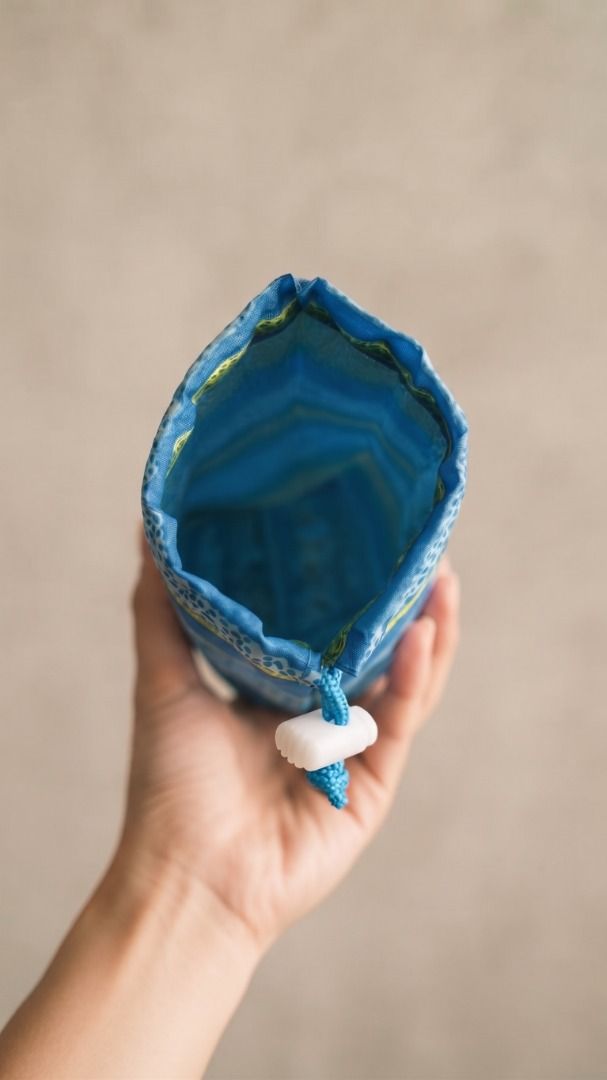 Blue Drawstring Pouch with Lace and Floral Pattern (Category: Purses & Pouches) located in Quezon City. Submitted by eilgaraje (Listing ID 1462930287, Image 2). Description: - Adorable blue pouch with pretty lace and floral patterns. - Secure drawstring closure with a white stopper. - Ideal for storing small essentials or as a charming gift bag. - Features a fabric with a subtle sheen. - Ready to find its new owner! bottle water bag or small fold