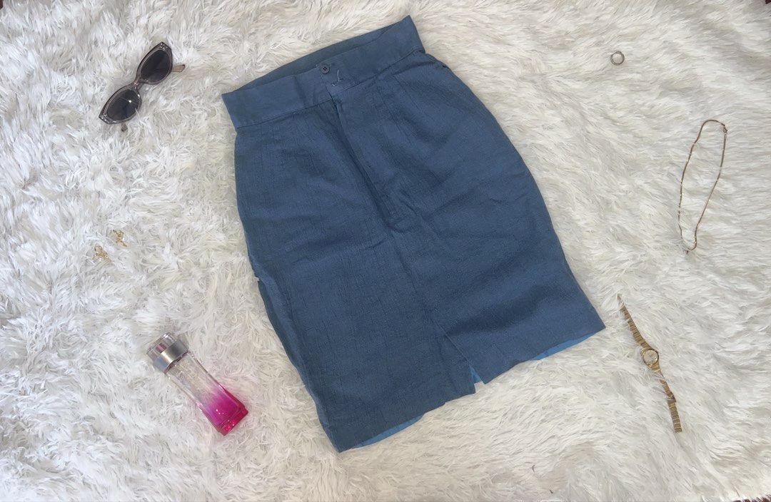 Blue Linen Blend Pencil Skirt (Category: Skirts) located in Tuguegarao City. Submitted by love_clothies (Listing ID 1462898761, Image 1). Description: - Classic blue pencil skirt - Front hem slit for ease of movement - Secure button and zip closure at the waist - Ideal for professional or smart casual outfits.