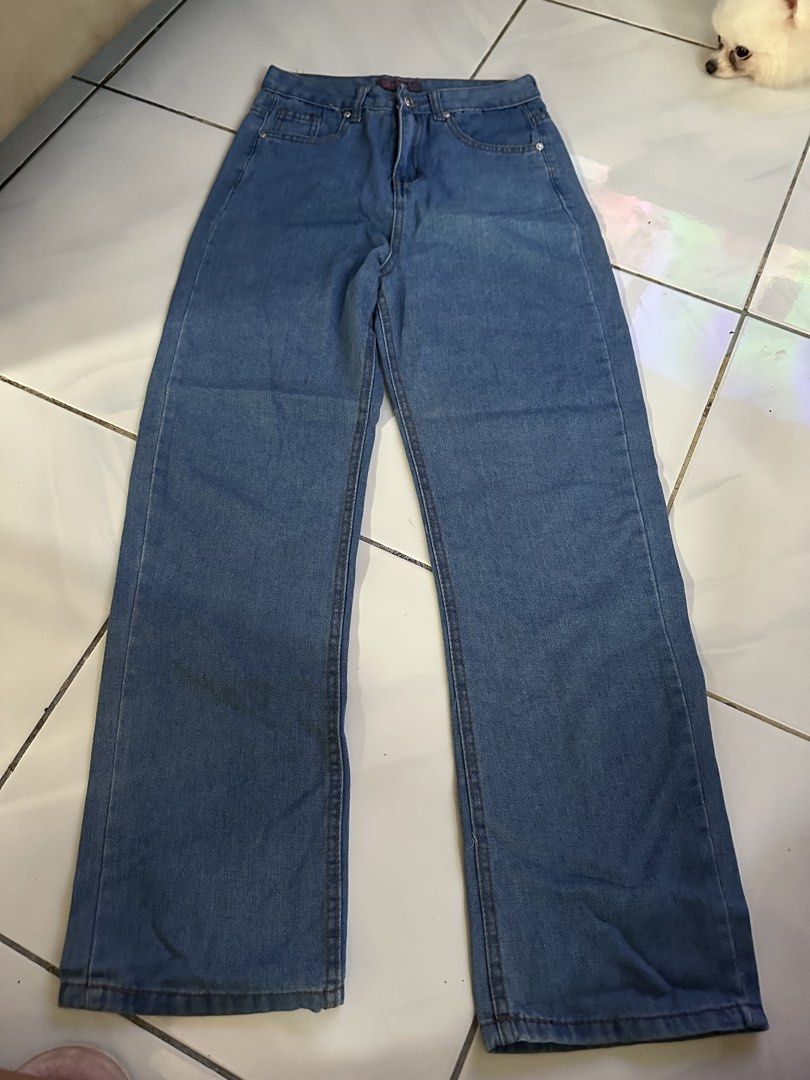 Blue Straight Denim Jeans (Category: Jeans) located in Caloocan City. Submitted by triciacab (Listing ID 1462937373, Image 1). Description: - Classic blue denim jeans - Wide leg cut for a relaxed fit - Button and zip front closure - Two front pockets - Two back pockets - Versatile for everyday wear - Easy to style with any top.
