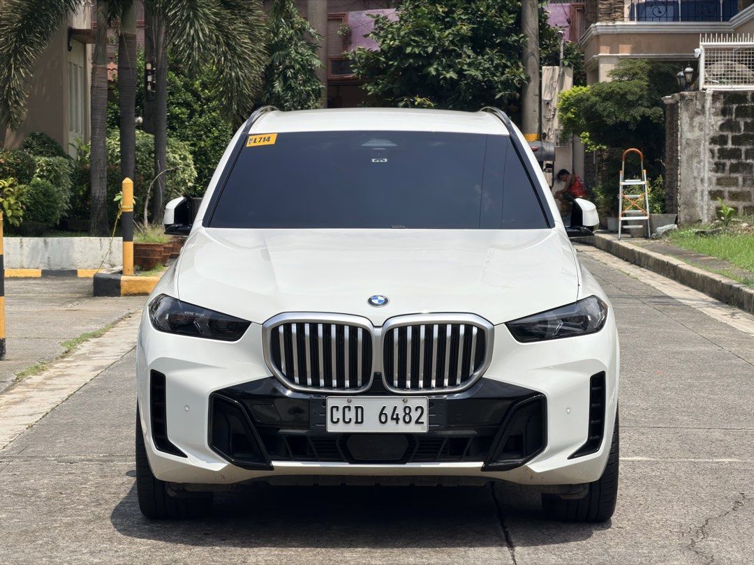 BMW X5 xDrive3.0D Msport Auto (Category: Used Cars) located in Quezon City. Submitted by raymondgo (Listing ID 1462953144, Image 2). Description: 2024 BMW X5 xDrive 3.0d M Sport 2025 ACQUIRED 3.0 Inline 6 Diesel Engine Mild Hybrid 8 Speed Automatic Transmission 8.890M - BRAND NEW PRICE 9k Odo - CASA MAINTAINED Top of the line Automatic Leather Seats M Leather seats, Caliper, Steering wheel, pedals M Adaptive Suspension Aerodynamics Bodykits 14.9 