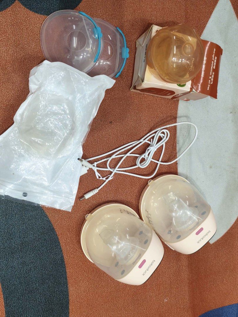 Bobo duck Wearable Breast Pump (Category: Breastfeeding & Bottle Feeding) located in Alicia. Submitted by thriftbagph (Listing ID 1463077904, Image 1). Description: - Pink & clear Bobo duck wearable breast pumps - Rechargeable and portable design - Easy to use and clean - Ideal for mothers on the go - All accessories shown in photos included ( nipple shield , nursing breast pads, breastmilk storage , wearable breast milk collector) - missing adap