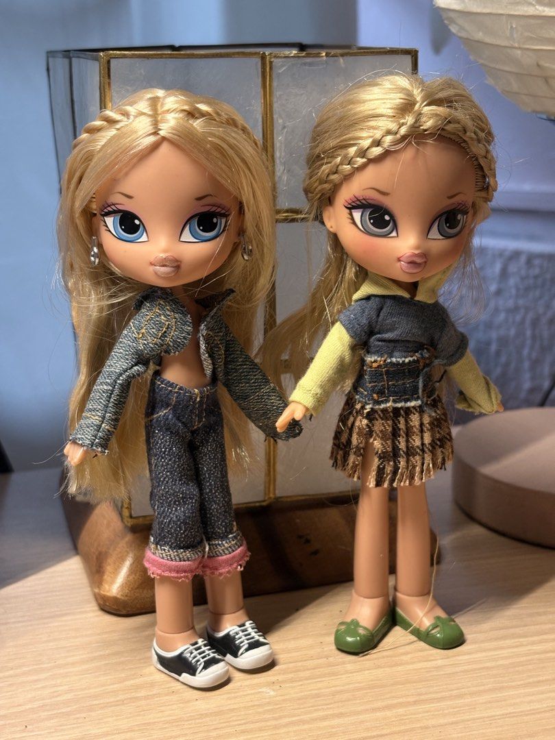Bratz Kidz Duo Chloe (Category: Kids Toys) located in Manila. Submitted by angelicb__01 (Listing ID 1462995137, Image 1). Description: - Two Bratz dolls ready for a fashion show. - Doll 1: Denim jacket and jeans with pink trim. - Doll 2: Denim top, green sleeves, and plaid skirt. Has a minor problem like easily bendable pero stable parin naman - Both dolls have blonde hair styled in braids. - Matching shoes included for both dolls. - Ideal for Br