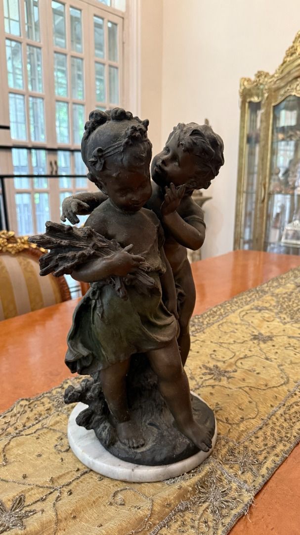 Bronze Cherub Sculpture with Marble Base (Category: Figurines & Statues) located in Cainta. Submitted by caroldy10 (Listing ID 1462955388, Image 1). Description: - Vintage bronze sculpture featuring two cherubs. - Mounted on a classic white marble base. - Adds a timeless, elegant touch to your home decor. - Perfect for display on shelves or tables. Price is slightly negotiable.