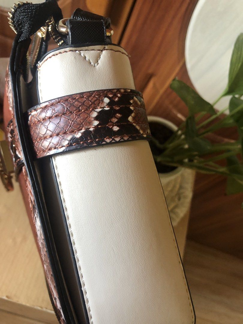 Brown and Snake Print Handbag with Gold Hardware (Category: Luxury Bags & Wallets) located in Makati City. Submitted by mitchi_koy28 (Listing ID 1462930784, Image 2). Description: - Cute handbag with mixed textures - Brown suede-like material on front and sides - Snake print accents on strap and trim - Gold hardware closure - Comes with a dust bag - Versatile for night out or everyday use.