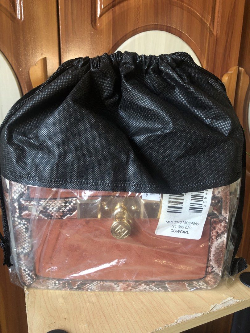 Brown and Snake Print Handbag with Gold Hardware (Category: Luxury Bags & Wallets) located in Makati City. Submitted by mitchi_koy28 (Listing ID 1462930784, Image 1). Description: - Cute handbag with mixed textures - Brown suede-like material on front and sides - Snake print accents on strap and trim - Gold hardware closure - Comes with a dust bag - Versatile for night out or everyday use.
