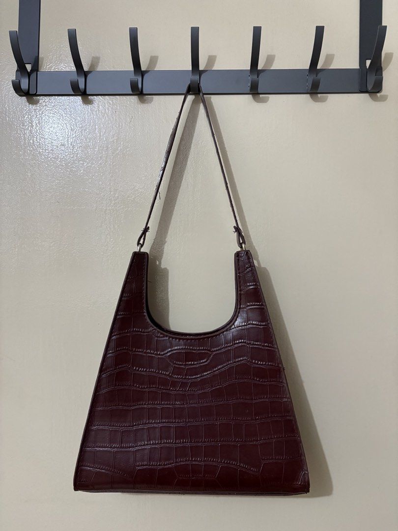 Brown Croc Embossed Shoulder Bag (Category: Shoulder Bags) located in Manila. Submitted by outtacloset (Listing ID 1463011314, Image 2). Description: - Unique brown shoulder bag - Croc embossed texture - Distinctive triangular shape - Single strap for comfortable carrying - Ideal for everyday use or evening outings - Fits your daily essentials.