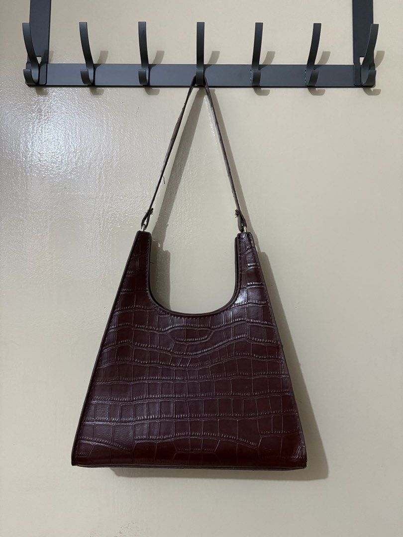 Brown Croc Embossed Shoulder Bag (Category: Shoulder Bags) located in Manila. Submitted by outtacloset (Listing ID 1463011314, Image 1). Description: - Unique brown shoulder bag - Croc embossed texture - Distinctive triangular shape - Single strap for comfortable carrying - Ideal for everyday use or evening outings - Fits your daily essentials.