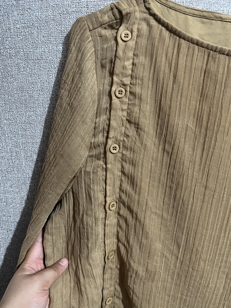 Brown Long Sleeve Blouse with Button Detail (Category: Blouses) located in Marikina City. Submitted by femmeshoppemnl (Listing ID 1462942039, Image 3). Description: Brown Long Sleeve Blouse with Button Detail Size: Small on tag but can fit up to L-XL Condition: Used. Has back to back working buttons Issue: Minimal lints Brand: Lit e Mode Ukay sourced. Washed - Ready to wear. .
